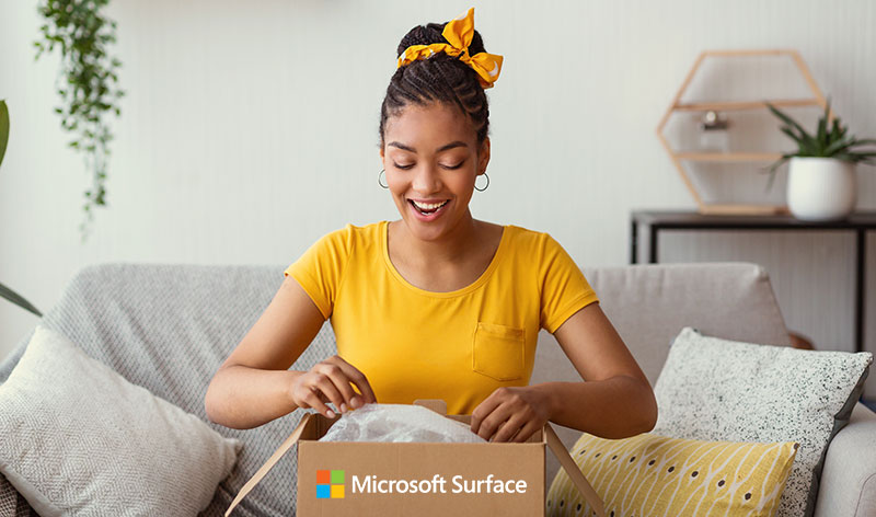 Woman opening a box from Microsoft